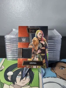 2022 Select WWE Selective Swatches #SW-ASK Asuka - Bild 1 von 2