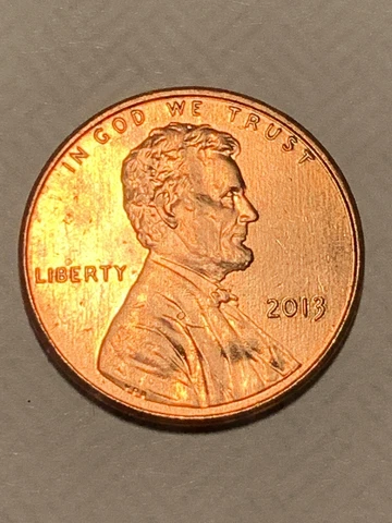 2013 die cracked on reverse side of coin circulated Lincoln cent is rd color Cover