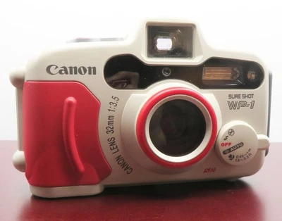 CÂMERA DE FILME VINTAGE CANON SURE SHOT WP-1 35mm à prova de intempéries FUNCIONA + filme Fujicolor - Imagem 1 de 4