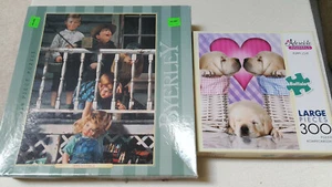 Set of 2 Puzzles Buffalo Puppy Love 300 Pc & MB Byerly Irresistible 550 Pc Used - Picture 1 of 8