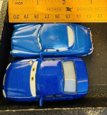 Mattel Disney Pixar Cars Christina Wheeland Race Fans & Hudson Hornet Lote De 2 - Imagem 1 de 4