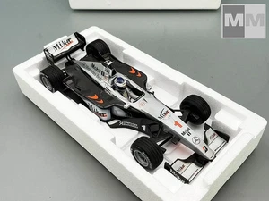 F1 McLAREN MP4/14 #1 Mika Hakkinen Campeón del Mundo 1999 1/18 MINICHAMPS 530991801 - Imagen 1 de 5