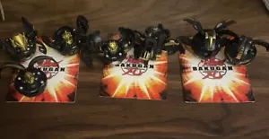 Lot Of 7 Bakugan Battle Brawlers BakuBronze Gold Black Bakugans - Picture 1 of 5