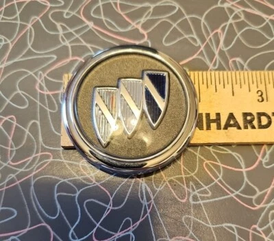 1990's Buick Park Avenue round badge Sail Panel Emblem OEM part no. 25551207  - Image 1 of 4