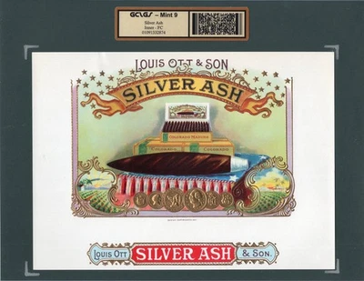 Antigua etiqueta original de cigarro PLATA CENIZA - ENORME CIGARRO EN ALMOHADA ROJA, BLANCA Y AZUL Foto 1 de 4