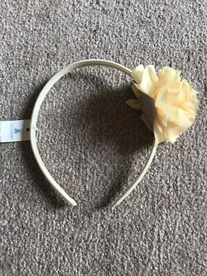 Nueva diadema Baby Gap flor amarilla Foto 1 de 2