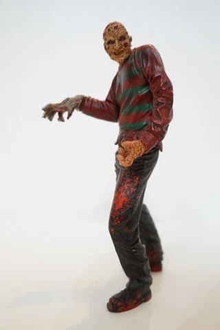 McFarlane Toys Freddy Krueger Action Figure Movie Maniacs Nightmare Elm Street Cover