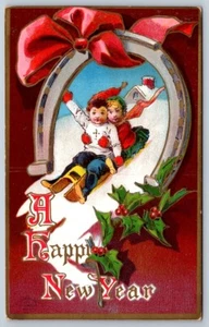 Feliz Año Nuevo, Trineo Niño y Niña, Herradura, H.I. Postal de felicitación Robbins - Imagen 1 de 2