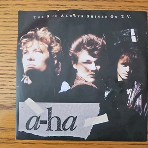 A-HA SUN ALWAYS SHINES ON T.V. (137) 7" s/w Treibholz. Bilderhülle - Bild 1 von 4