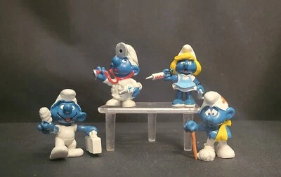 4 винтажных смурфа медсестра смурфетта, доктор смурф, смурф первой помощи и травмированный смурф. - Изображение 1 из 3