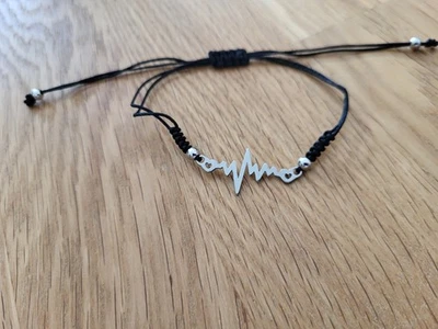 Armband schwarz mit silbernem Anhänger Heartbeat größenverstellbar Accessorize - Bild 1 von 2
