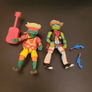 Figuras Playmates TMNT Tortugas Ninja Mutante Caos Playa Vagabundo Mikey Vaquero Leo - Imagen 1 de 2