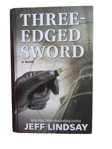 Three-Edged Sword (Lge Pnt HC) by Jeff Lindsay 2023 VG - Imagen 1 de 5
