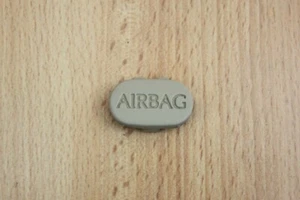"AIRBAG" BADGE FOR FRONT SEAT ESCUTCHEON (OATMEAL) - Jaguar XK8 XKR 2001-2006 - Picture 1 of 2