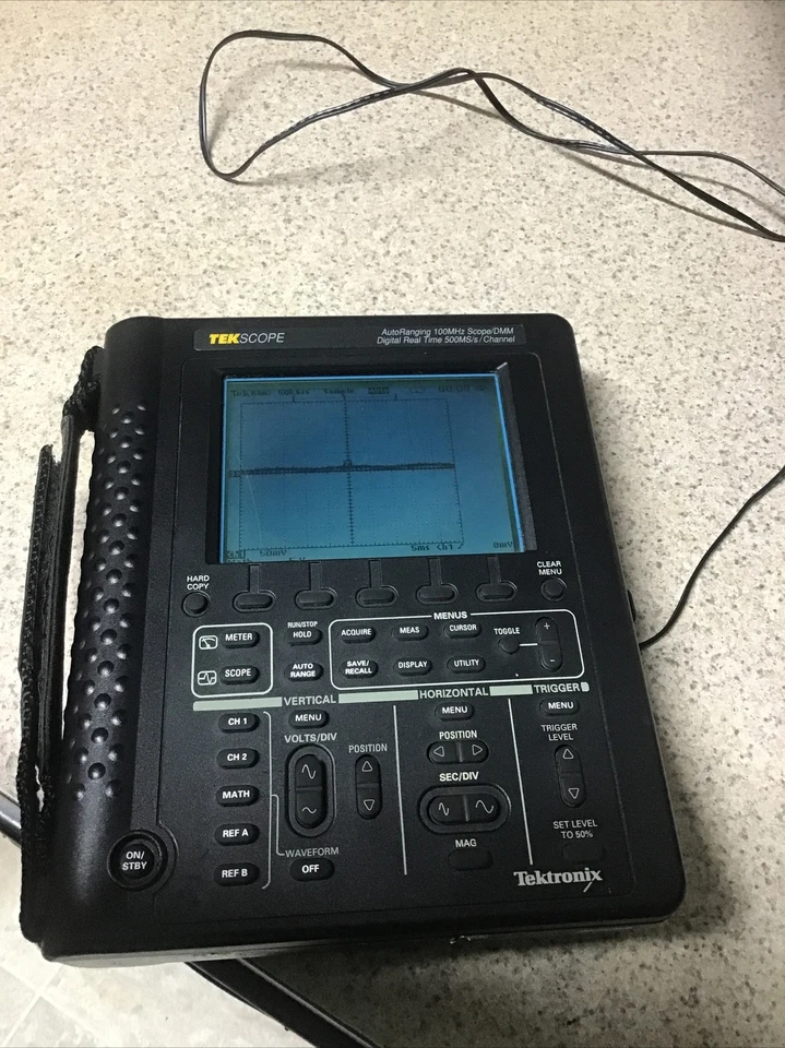 Mira telescópica Tektronix TekScope rango automático THS 720 100 MHz/DMM digital en tiempo real 500 MS/ Foto 1 de 4
