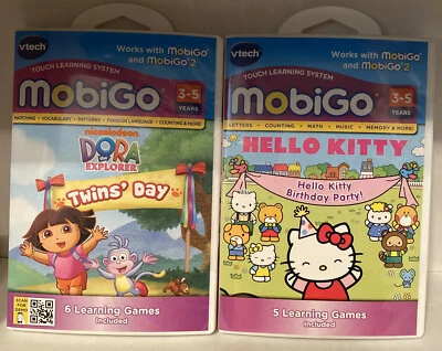 2 Lot NEW VTECH MOBIGO HELLO KITTY BIRTHDAY PARTY! Dora The Explorer Twins’ Day - Image 1 of 4