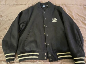 Undefeated Black Varsity Jacket Size S - Used, NOTE: the stripes are white - Picture 1 of 3