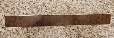 Lincoln Mark IV 1972-76 borde del panel de instrumentos (lado del pasajero) aspecto de madera burl Foto 1 de 4