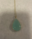 14KT YELLOW GOLD PENDANT WITH DIAMONDS AND CHALCEDONY ON CHAIN.
