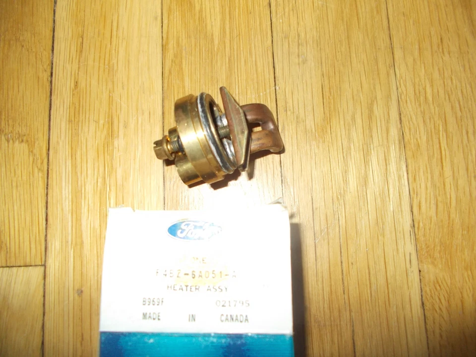 NOS 1994 - 1997 FORD ASPIRE ENGINE HEATER BLOCK ASY F4BZ-6A051-A - Image 1 of 1