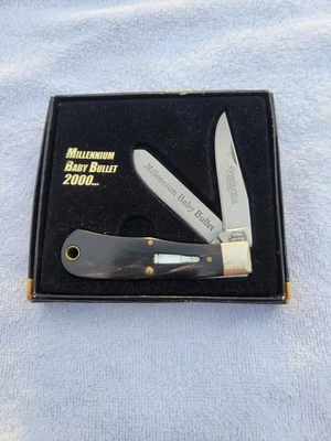 Cuchillo bala plegable Remington EE. UU. 2000 #R1173 cuerno de búfalo nuevo en caja  Foto 1 de 4