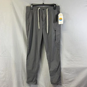 Pantalones Vuori Para Hombre Gris Medio Transit Jogger Rendimiento Elastizados Cremallera Bolsillo Tecnología - Imagen 1 de 9