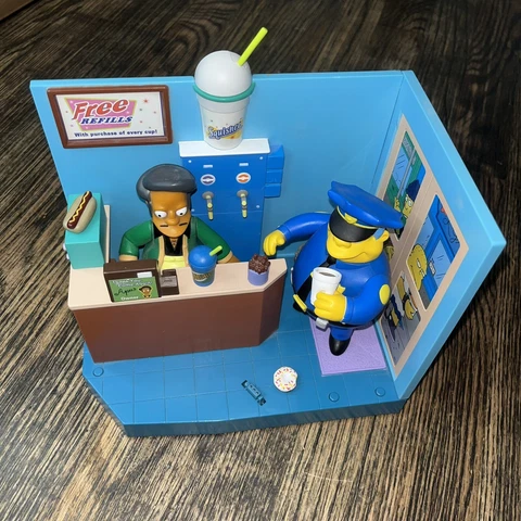 The Simpsons World Of Springfield Lot Kwik-e-Mart Playset Apu & Chief Wiggum Cover