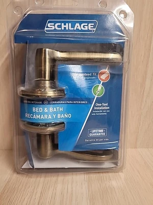 Cerradura de privacidad para cama y baño Schlage F40 V FLA 609 palanca de puerta estilo, latón antiguo Foto 1 de 4