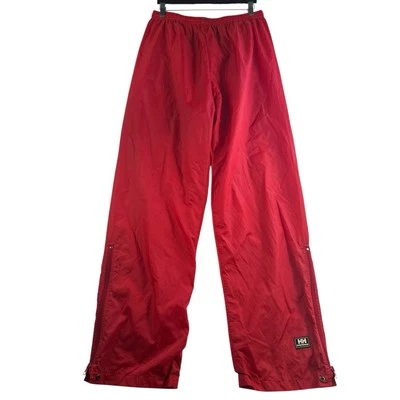 Pantalones de lluvia grandes Helly Hansen L rojos empacables de nailon resistentes al agua Foto 1 de 4
