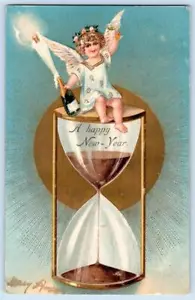 1906 FELIZ AÑO NUEVO ÁNGEL EN RELOJ DE ARENA BOTELLA CHAMPÁN POSTAL EN RELIEVE - Imagen 1 de 2
