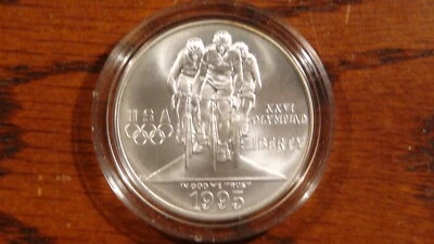 1996 D ATLANTA OLYMPICS CYCLING 1 OZ .999 SILVER COIN IN HARD CAPSULE! - Image 1 of 2