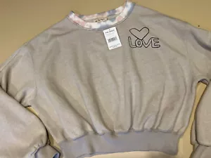 NWT Free People " We The Free".     Cropped Sweatshirt. $148.     XS - Picture 1 of 6