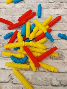 100x TOMY Popoids. Building, Sensory, Stress Fidget Toy Tubes. New - Picture 1 of 5