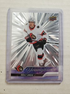2023-24 Upper Deck Series 1 Young Guns Ridly Greig Silver Outburst #212 Rookie