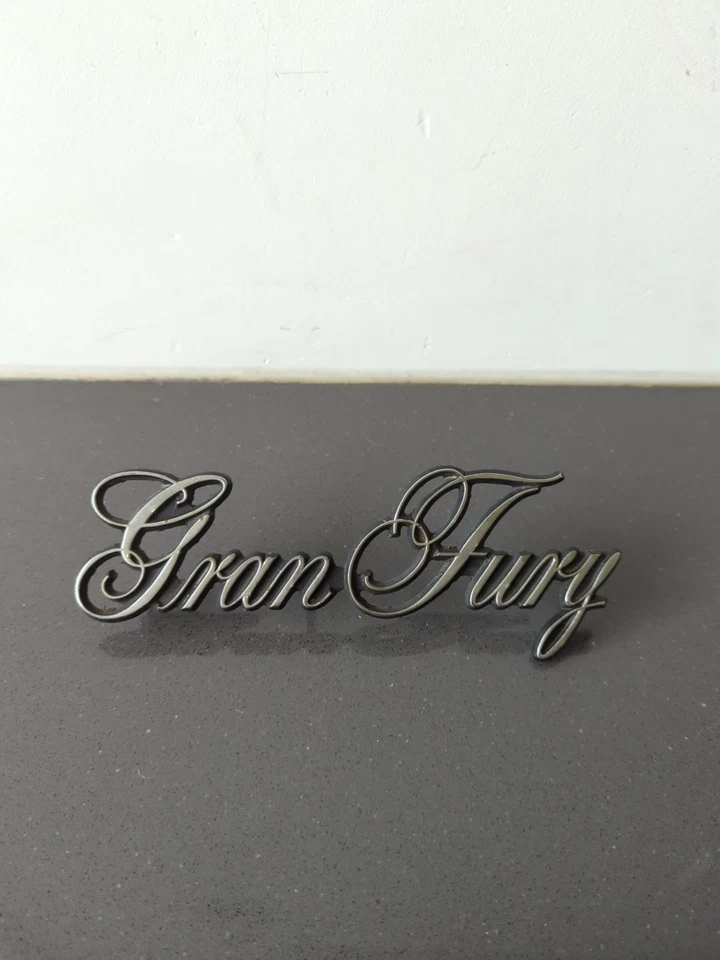 Used OEM Mopar Script Emblem 3811505 1975-1977 Plymouth Gran Fury (293) M40 - Image 1 of 4