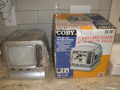 NEW COBY CX-TV1 5" BLACK AND WHITE TELEVISOIN AM/FM RADIO OPEN BOX - Image 1 of 4