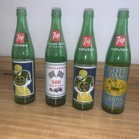 Four 7UP Commemorative Bottles  2 - 1977  1 -1973 Notre Dame  1 - 79 Indy 500  ! Cover