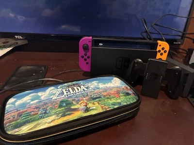 Consola Nintendo Switch System 32 GB con Joy-Cons púrpura y naranja, base de cargador + Foto 1 de 2