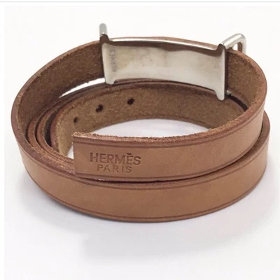 Bracelet Hermès en cuir double enveloppe marron camel argent quincaillerie... - Photo 1/4