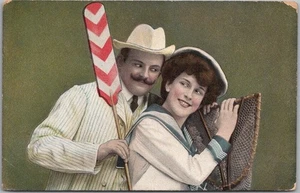 Vintage 1908 Fishing / Romance Greetings Postcard Couple / Boat Paddle & Net - Picture 1 of 2