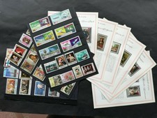 Kingdom of Yemen and Dubai: 51 stamps + 6 album pages with 18 stamps