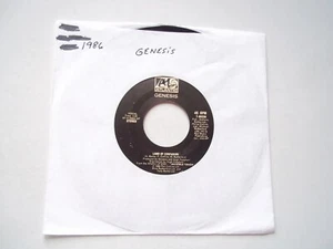 GENESIS - Land Of Confusion / Feeding The Fire - 45 RPM Record 7" Single 1986 - Picture 1 of 6