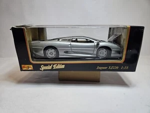 Coche diecast Intex Maisto escala 1:18 Jaguar XJ220 edición especial plateado 1992 - Imagen 1 de 13