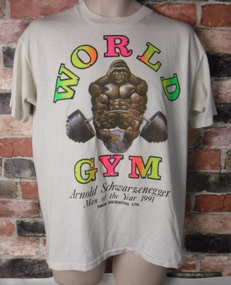 VINTAGE WORLD GYM SHIRT DOUBLE SIDED ARNOLD SCHWARZENEGGER MAN OF THE YEAR 1991 - Image 1 of 3