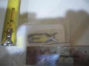 KIA SE LETTERS SYMBOL EMBLEM CHROME OEM ORIGINAL NEW BAGDE - Picture 1 of 1