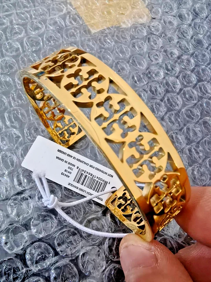 NOVO TORY BURCH LOGOTIPO OCO EM OURO COR Pulseira - Imagem 1 de 4
