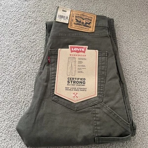 Pantalones elásticos verdes utilitarios ropa de trabajo rectos sueltos talla 30x32 para hombre Levi's 565 - Imagen 1 de 18