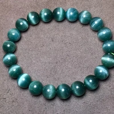 Natural Cat's Eye Green Rutilated Quartz  round  beads   Bracelet - Image 1 of 4
