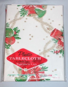 NIP Cute Vintage Plastic Christmas Tablecloth 52 x 108 Candles Bells Ornaments - Picture 1 of 3