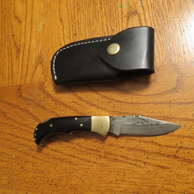 Cuchillo de hoja plegable Damasco con mango de hueso negro y funda de cuero hecho a mano Foto 1 de 4